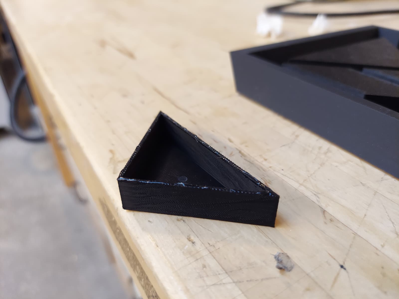 Close-up of hollow triangular tangram piece